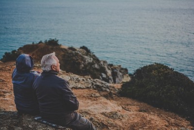 image of elder couple gazing over the ocean