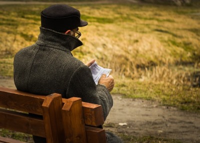image of man sitting on a bench